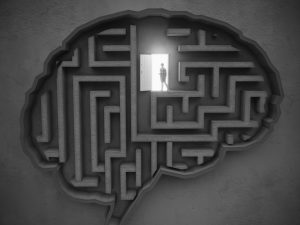 Person finds and opens the door in the maze-shaped brain on the wall