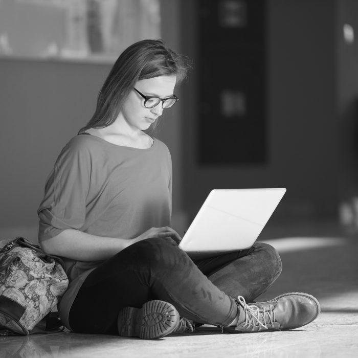 LGBTQ-affirming clinical supervision for therapists image of a person on their laptop